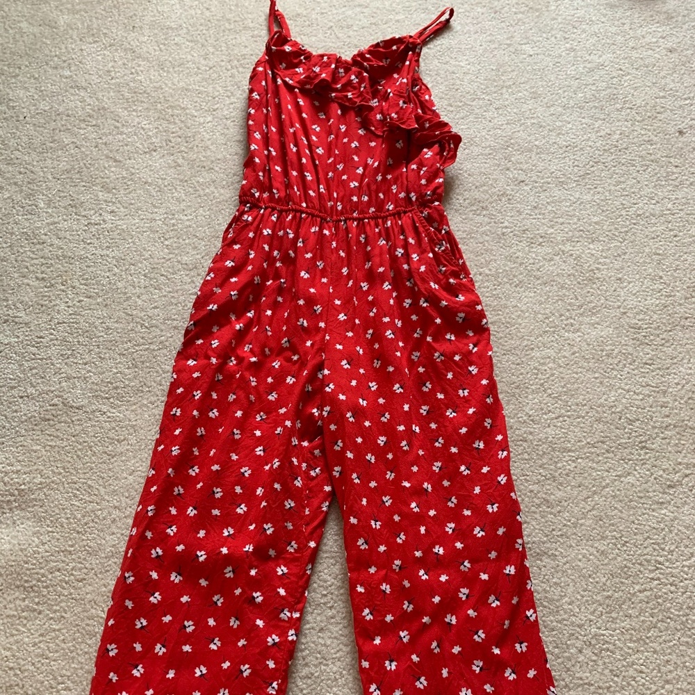 Red jumpsuit with white flowers